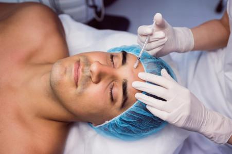 man receiving botox injection on his forehead 1024x683 1