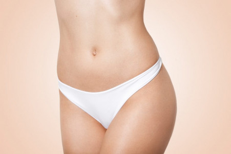slim body woman white lingerie beige female with perfect figure showing her flat smooth belly 1024x683 1