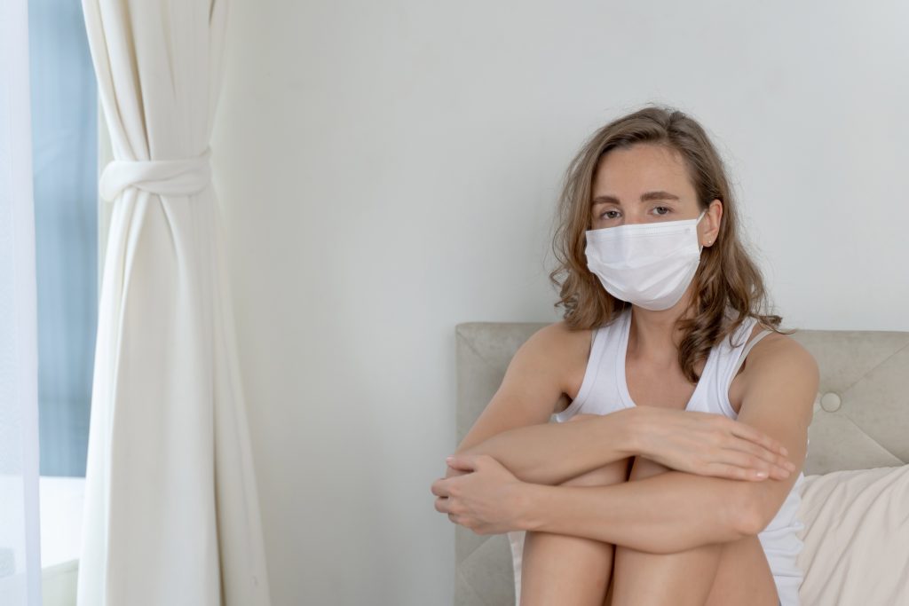 woman wearing face mask protect feeling sick headache cough because coronavirus covid 19 quarantine room 1024x683 1