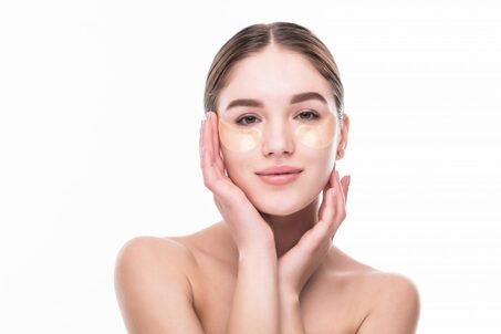 close up young woman with patches eyes from wrinkles dark circles isolated white wall 1024x683 1