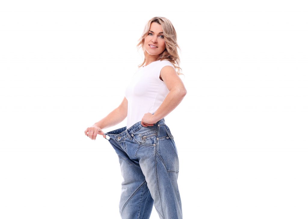 portrait happy aged woman with big jeans 1024x728 1