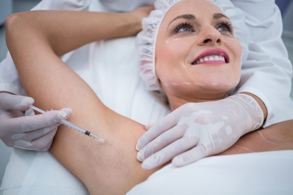 doctor injecting woman her arm pits 1024x683 1