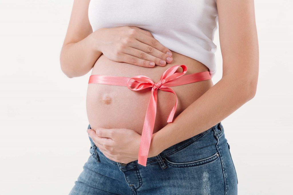 cropped image pregnant woman presents gift 1 1024x683 1