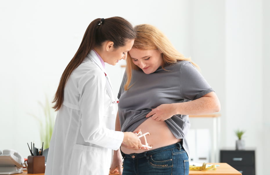 woman getting stomach measured